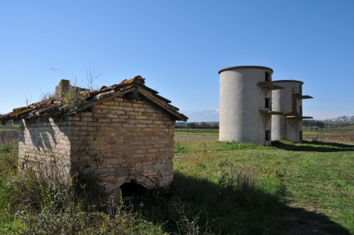 Silos near the abandoned farmhouse