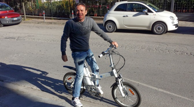 Happy man on a little bike