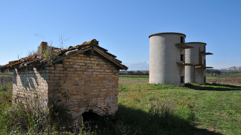 Silos near the abandoned farmhouse