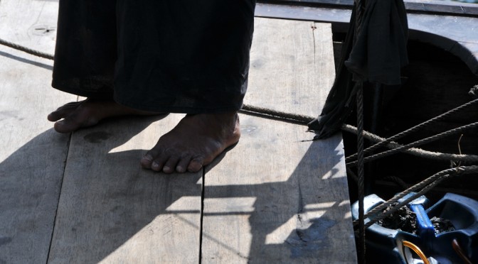 Feet on a boat