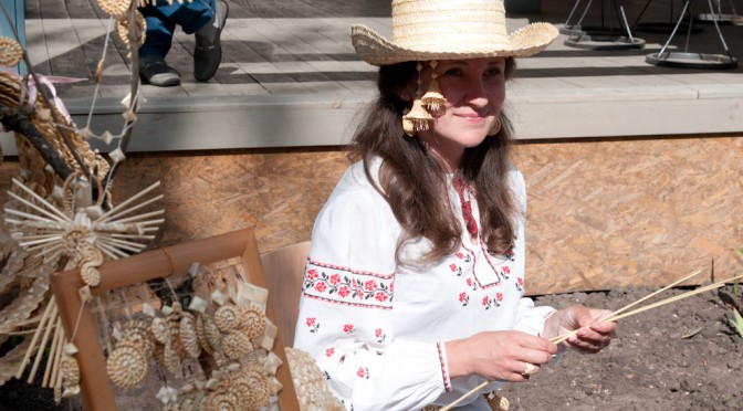 GIRL WITH HER PRODUCTS MADE OF GRASS