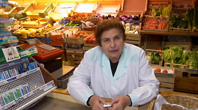 CONCETTA IN HER FRUITS AND VEGETABLE SHOP
