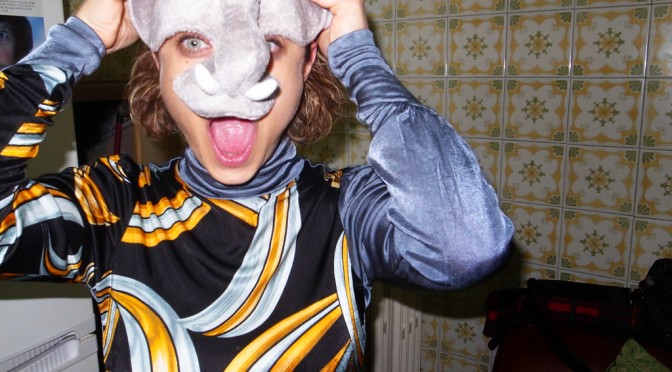 Marzia in her birthday party with a elephant mask