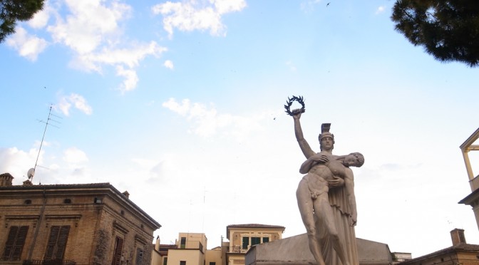 Sunset on war memorial in Plebiscito Square