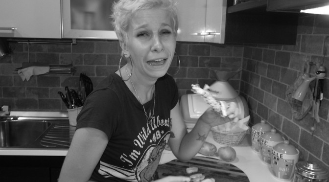 Valeria is cutting onions