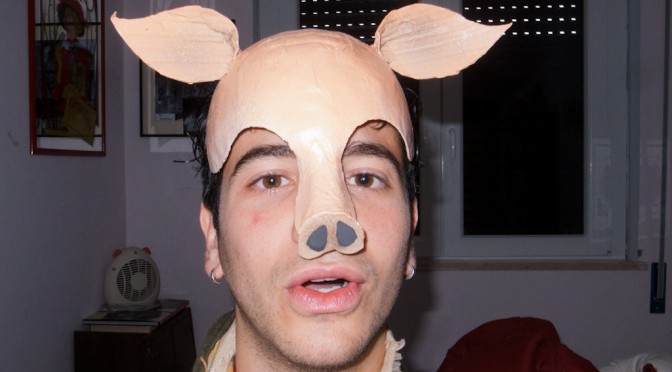 LUCA ROMAGNOLI WEARING A PORK MASK